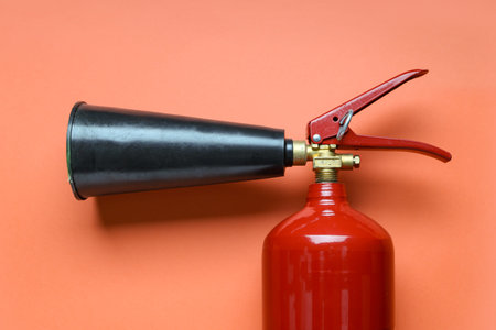 Fire extinguisher on red background