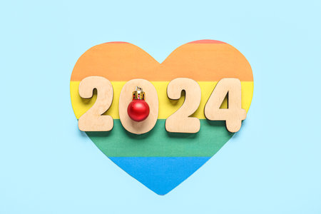 Paper heart with figure 2024 and Christmas ball on blue background. LGBT conceptの写真素材