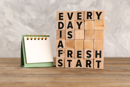 Cubes with text EVERY DAY IS A FRESH START on tableの写真素材