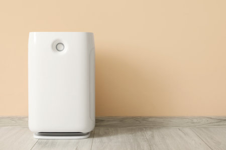 Air purifier near beige wall in roomの写真素材