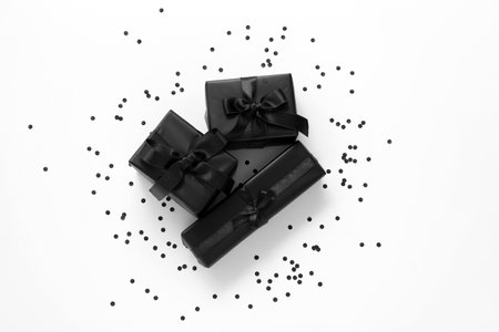 Gift boxes and confetti on white background. Black Fridayの写真素材
