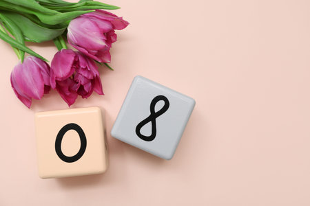 Cube calendar with date 08 and beautiful purple tulips on pink background. International Women's Day