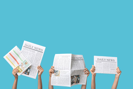 Women with newspapers on blue backgroundの写真素材