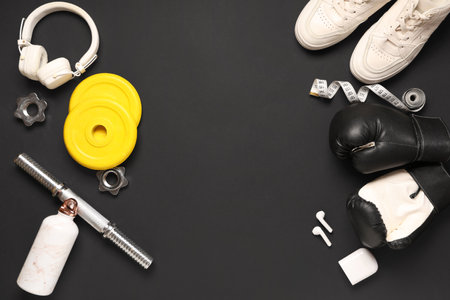 Composition with sports equipment and headphones on dark backgroundの写真素材