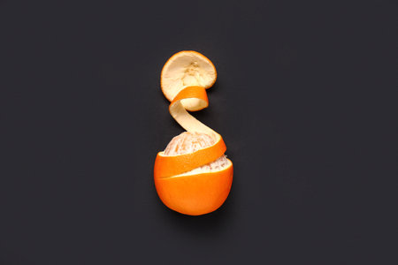 Fresh peeled orange on dark backgroundの写真素材