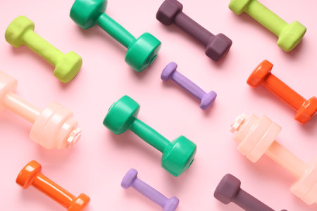 Composition with different dumbbells on pink backgroundの写真素材