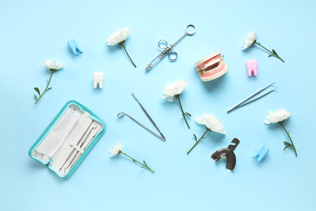 Composition with dentist's supplies and flowers on color background. International Women's Dayの写真素材