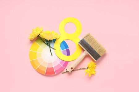 Composition with paper figure 8, paint brush and palette samples on color background. International...