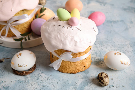 Composition with delicious decorated Easter cake and painted eggs on color background