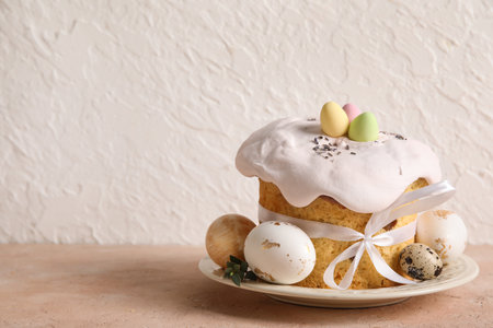 Composition with delicious Easter cake and painted eggs in plate on color backgroundの写真素材