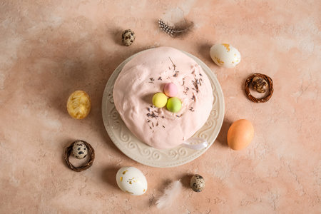 Composition with delicious Easter cake and painted eggs in plate on color background. Top view