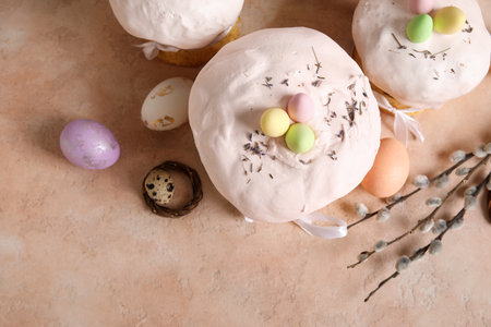 Composition with delicious decorated Easter cakes and painted eggs on color background. Top viewの写真素材