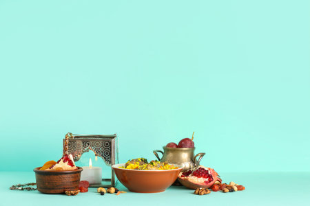 Traditional Eastern dishes and Muslim lantern on turquoise background. Ramadan celebration