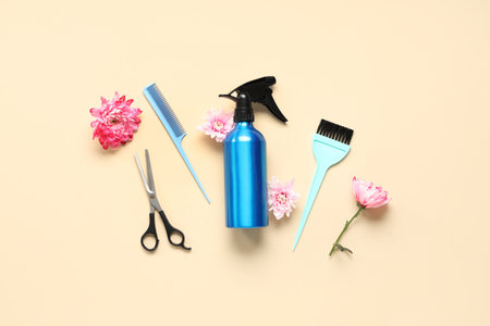 Composition with hairdresser's tools and flowers on color background. International Women's Dayの写真素材