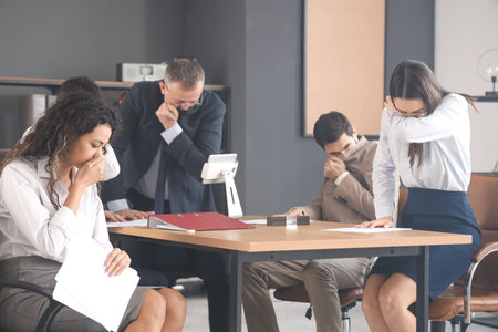Business people choking on smoke in burning office buildingの写真素材