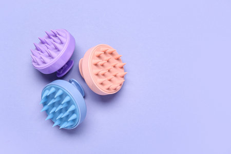 Hair scalp massagers on purple background