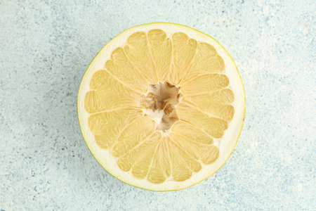 Half of fresh pomelo fruit on white backgroundの写真素材