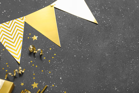 Beautiful composition with decorations for New Year party on black backgroundの写真素材
