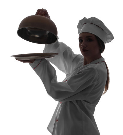 Silhouette of female chef with cloche on white backgroundの写真素材