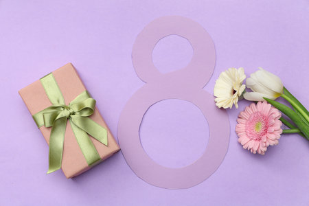 Figure 8 made of paper with different beautiful flowers and gift box on purple background. International Women's Dayの写真素材
