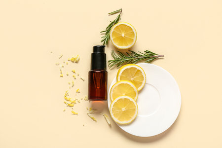 Composition with bottle of cosmetic product, fresh lemon and rosemary on color backgroundの写真素材