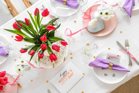 Elegant table setting with tulip flowers for International Women's Day celebration