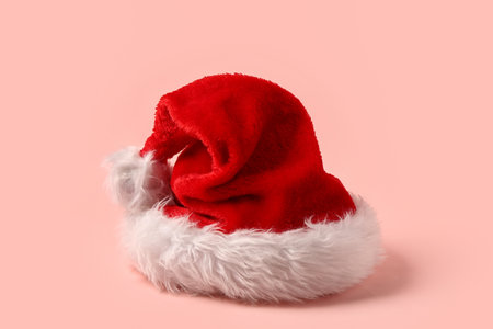 Santa Claus hat on pink backgroundの写真素材