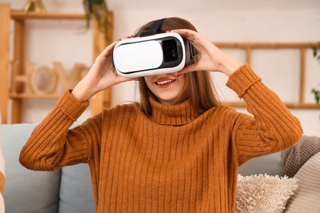 Young woman with VR glasses at home