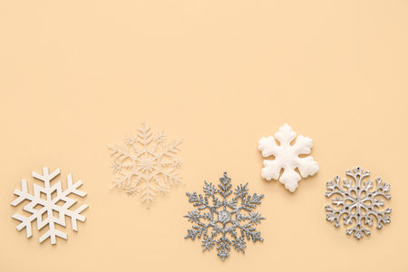 Christmas decorative snowflakes on beige background