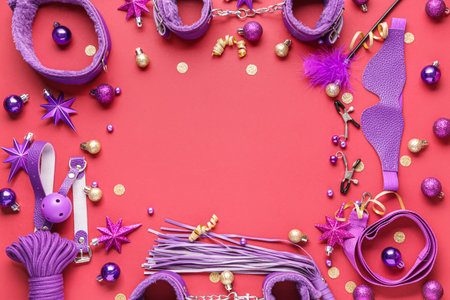 Frame made of sex toys with Christmas decor on red backgroundの写真素材