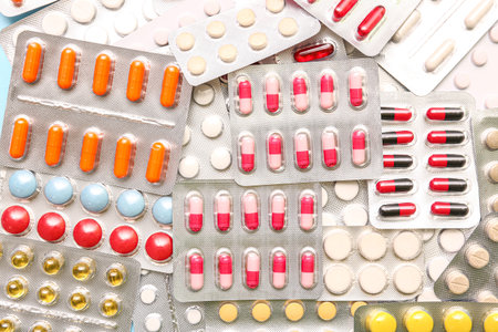 Blister packs with different pills as background
