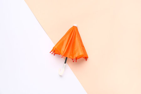 Mini stylish umbrella on colorful backgroundの写真素材