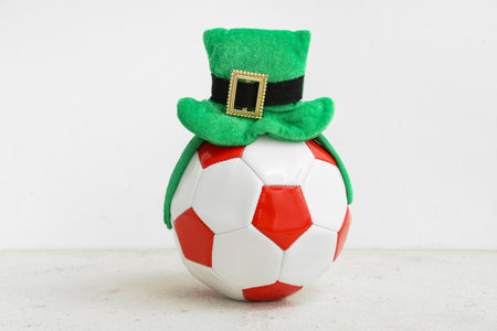 Soccer ball with leprechaun's hat on white grunge background. St. Patrick's Day celebrationの写真素材