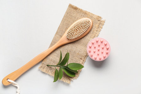 Hair scalp massager and body brush on gray backgroundの写真素材