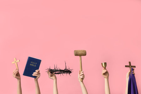 Female hands with Holy Bible, wooden crosses and crown of thorns on pink background. Good Friday conceptの写真素材