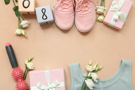 Composition with body roller, shoes, gifts and flowers for International Women's Day on color backgroundの写真素材