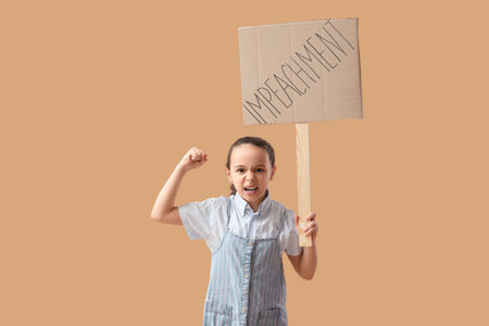 Protesting little girl holding placard with the word IMPEACHMENT on beige background