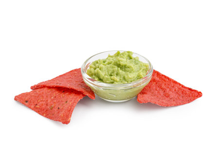 Red nachos and tasty guacamole on white backgroundの写真素材
