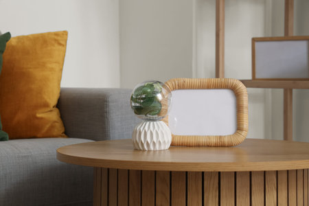 Interior of comfortable living room with coffee table and houseplant