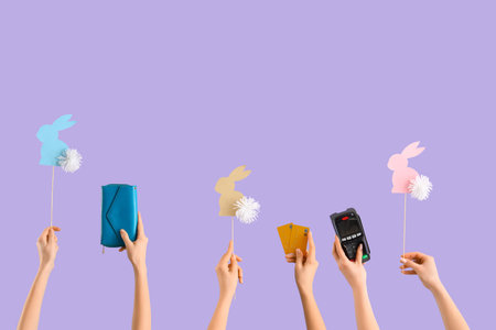 Women with payment terminal, wallet, credit cards and Easter rabbits on lilac background. Online...