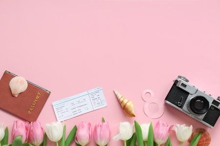 Composition with photo camera, ticket and tulip flowers for International Women's Day on pink backgroundの写真素材
