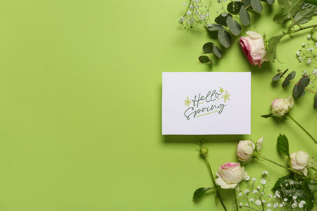 Greeting card with text HELLO SPRING, beautiful roses, gypsophila flowers and eucalyptus on green...