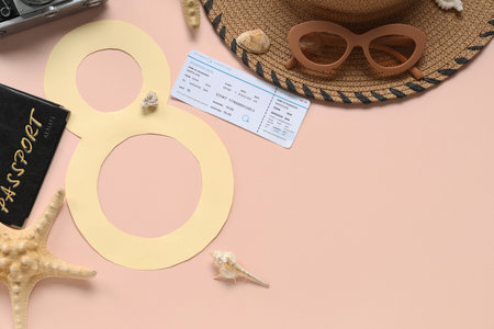 Composition with paper figure 8, ticket and beach accessories on color background. International...