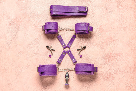 Different purple sex toys on beige backgroundの写真素材