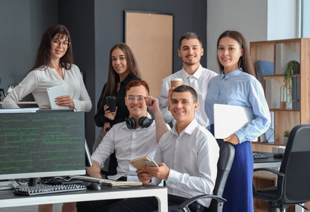 Team of young programmers working in officeの写真素材