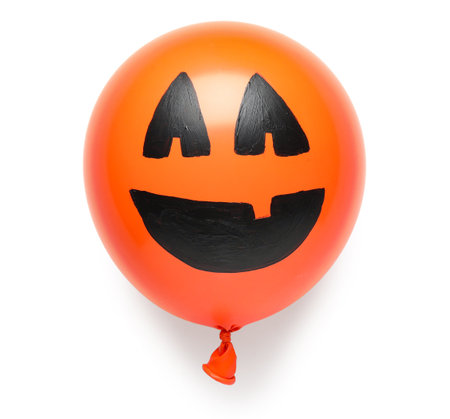 Funny Halloween orange balloon on white backgroundの写真素材