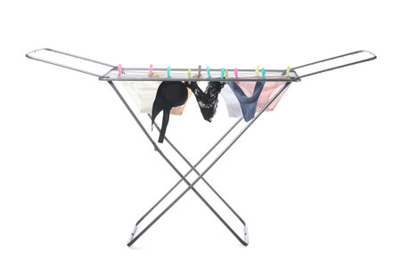 Dryer with clean female panties on white backgroundの写真素材
