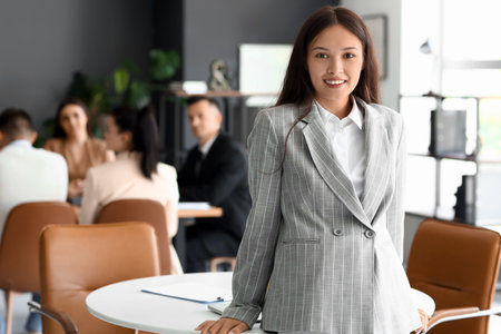 Portrait of Asian businesswoman in conference hallの写真素材