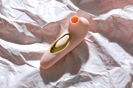 Vibrator on white crumpled paperの写真素材