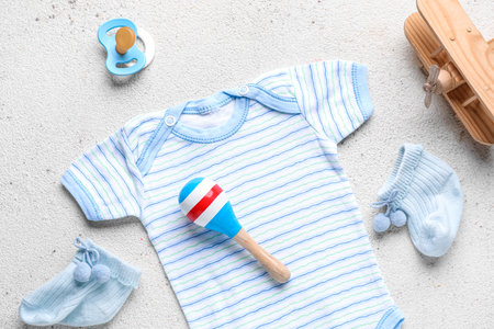Composition with baby clothes and accessories on light background, closeupの写真素材